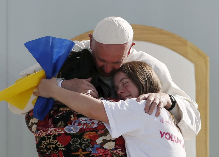 Pope Francis hugging youths_ REUTERS_Carlos Garcia Rawlins.jpg
