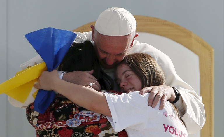 Pope Francis hugging youths_Cropped_ REUTERS_Carlos Garcia Rawlins.jpg