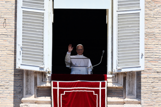 Pope Leo XIV leads the Regina Caeli prayer from his window in St. Peter's Square