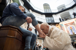 Pope Francis kisses the foot of an inmate at the Regina Coeli prison during the Holy Thursday celebration in Rome, Italy, March 29, 2018